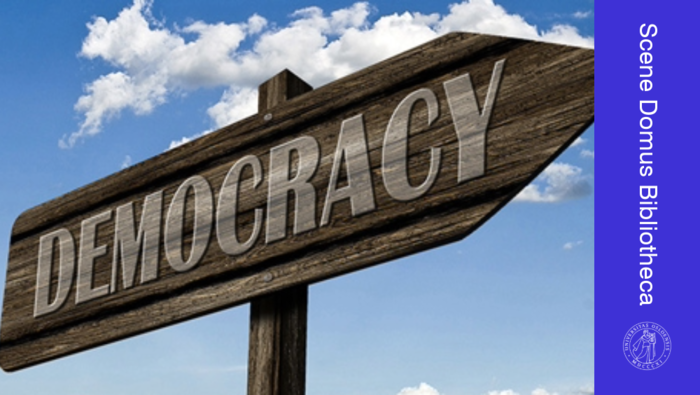 A sign with "Democracy" written on it