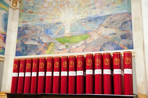 Doctor diplomas are packed in red sleeves.