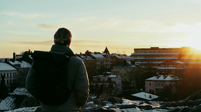 man looking at sunset