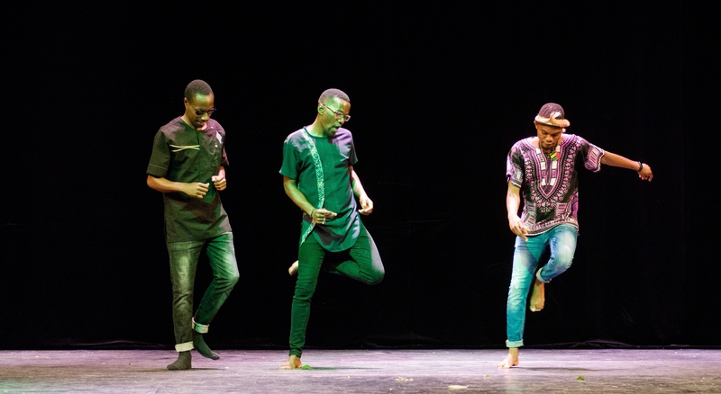 Performers show a dance from an african country.