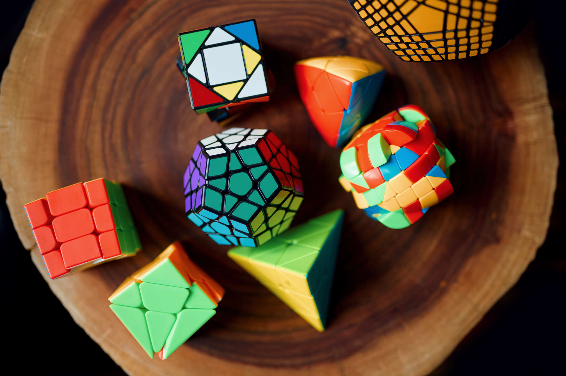 Many Rubiks cubes in different sizes, shapes and colors