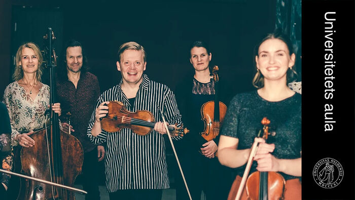 Five people smiling at the camera while holding instruments