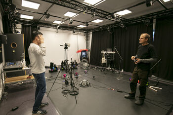 Tripod ,Musician ,Audio equipment ,Entertainment ,Film crew.