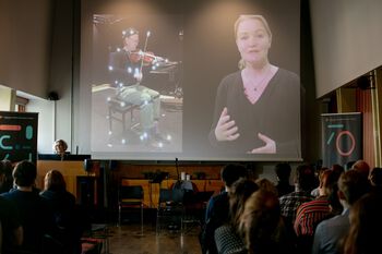 Chair ,Projection screen ,T-shirt ,Event ,Presentation.