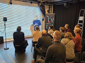 Electronic device ,Event ,Jeans ,Ceiling ,Technology.