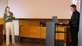 Microphone ,Podium ,Outerwear ,Table ,Furniture.