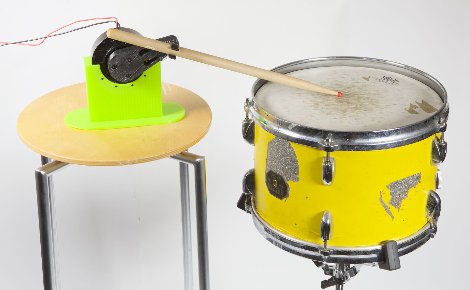 Image may contain: Membranophone, Musical instrument, Drum, Musical instrument accessory, Yellow.