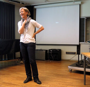 Standing ,Orator ,Event ,Shoulder ,Public speaking.