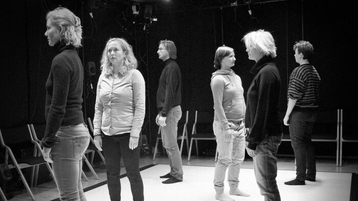 6 people standing on the floor