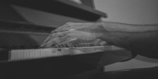 Hands, piano keys. Photo.