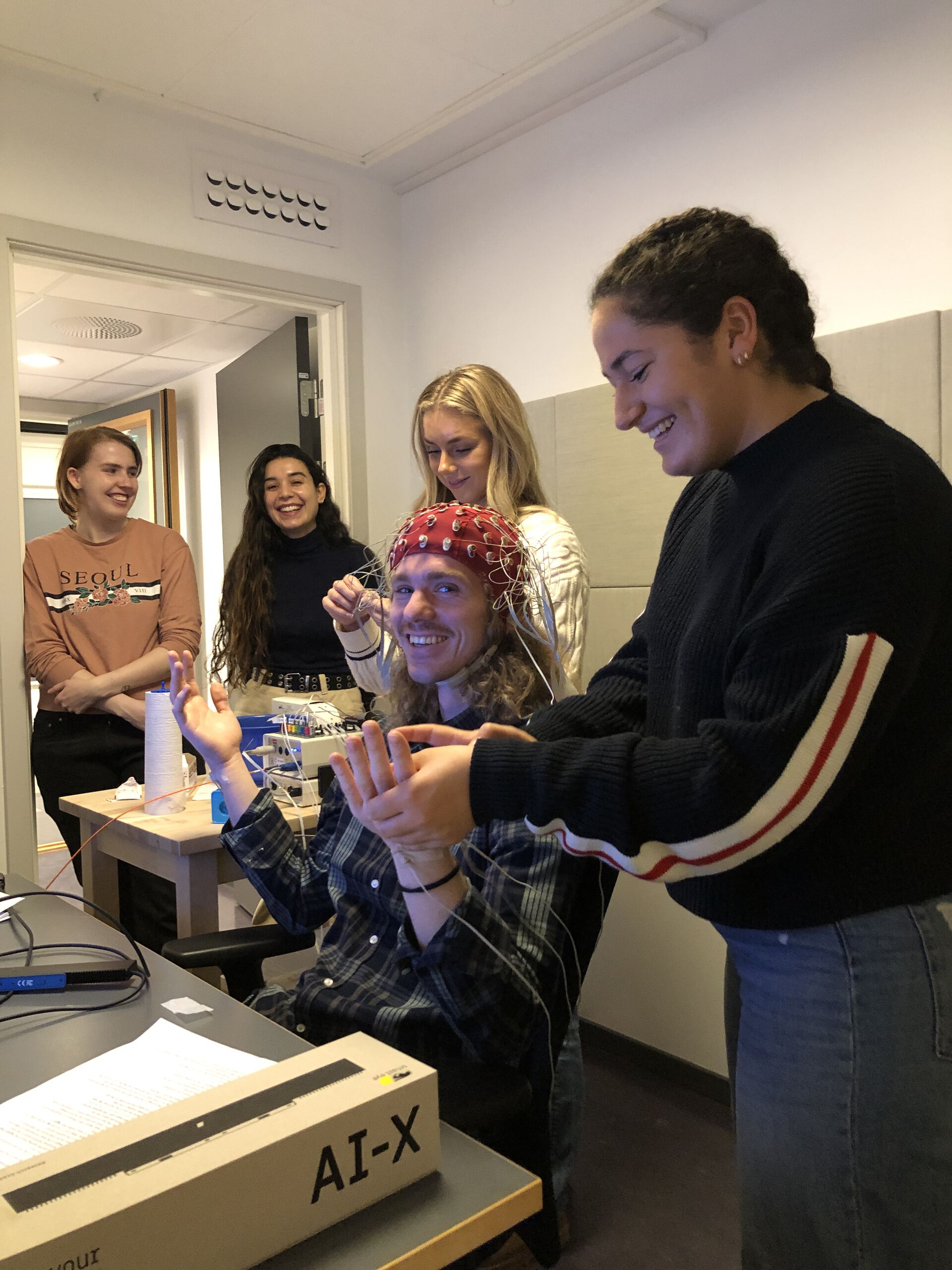Research assistants preparing EEG recording.