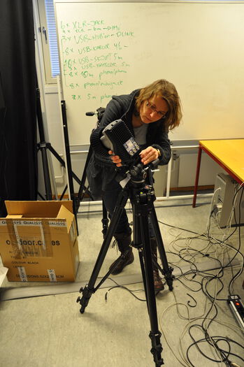 Furniture ,Tripod ,Table ,Videographer ,Chair.