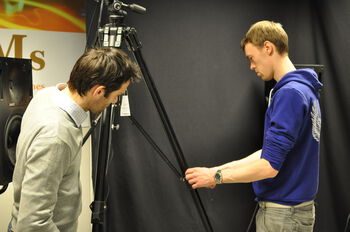 Watch ,Videographer ,Gesture ,Tripod ,Television crew.