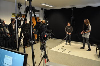 Tripod ,Personal computer ,Television crew ,Laptop ,Videographer.