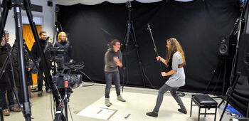 Jeans ,Trousers ,Tripod ,Audio equipment ,Film studio.