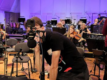 Clothing ,Musician ,Electronic device ,Video camera ,Entertainment.