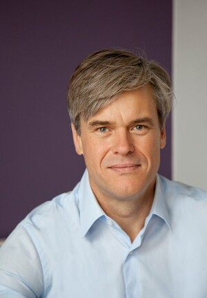 Professional-looking man smiling professionally