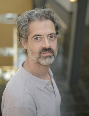 Man with glasses and beard, looking eager to conduct some science