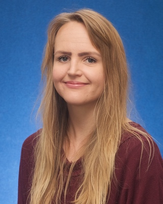 Woman, blond, blue background