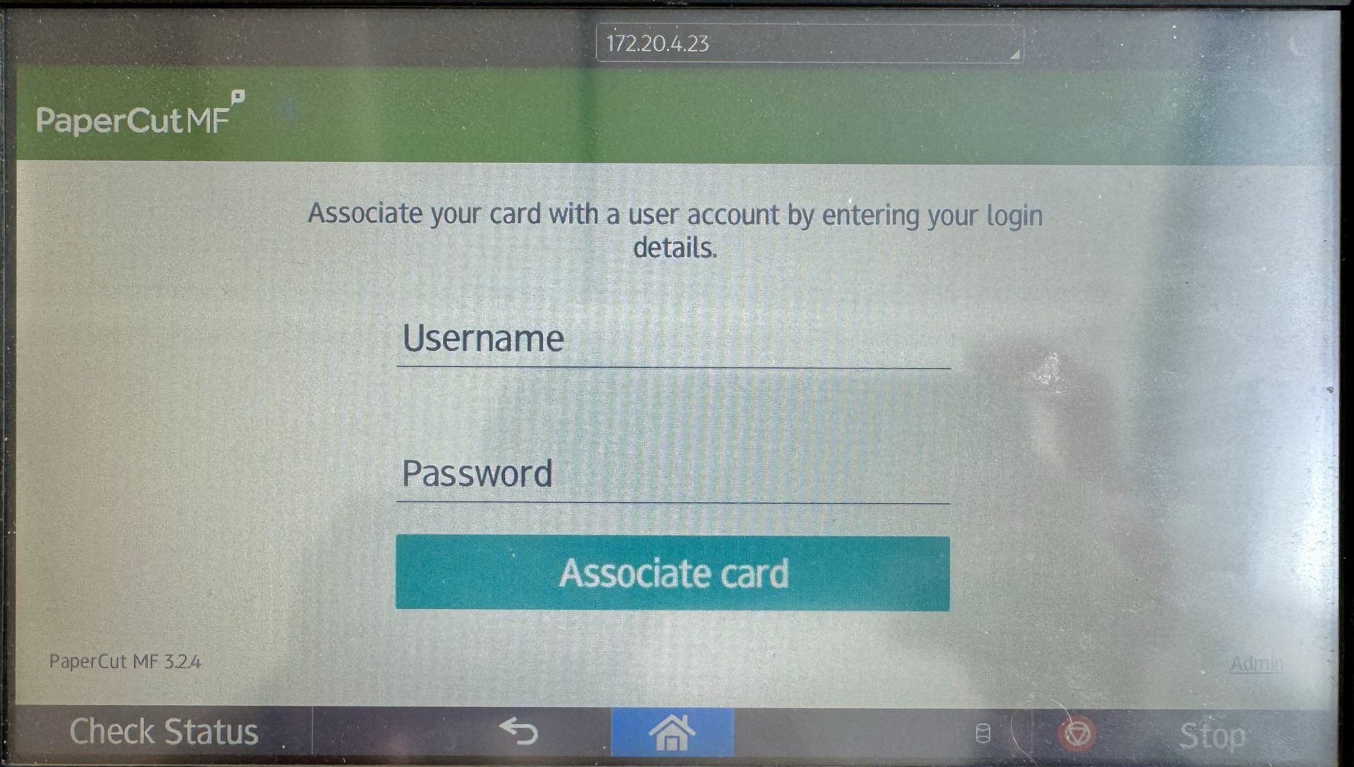 Image of the screen of a printer, with a textbox for username and password, and a button to associate the card with the login information